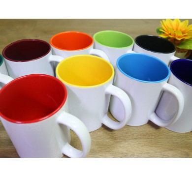 Ceramic mug with white ears, colors inside.